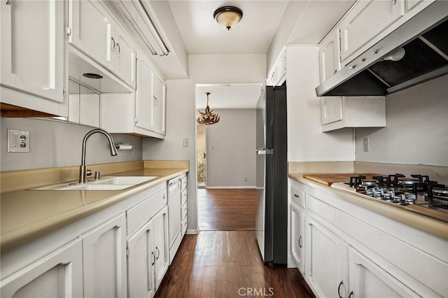 kitchen featuring dark hardwood / wood-style floors, white cabinetry, sink, and stainless steel appliances