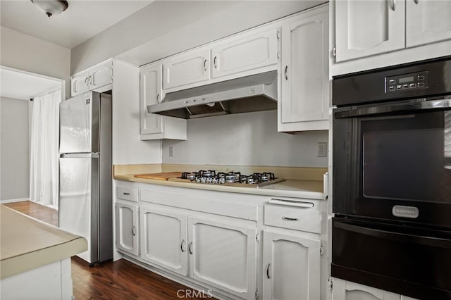 kitchen featuring dark hardwood / wood-style flooring, white cabinets, and stainless steel appliances