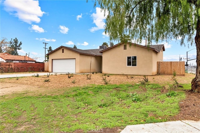 ranch-style home featuring a garage