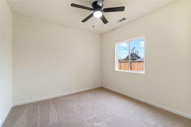 carpeted empty room featuring ceiling fan