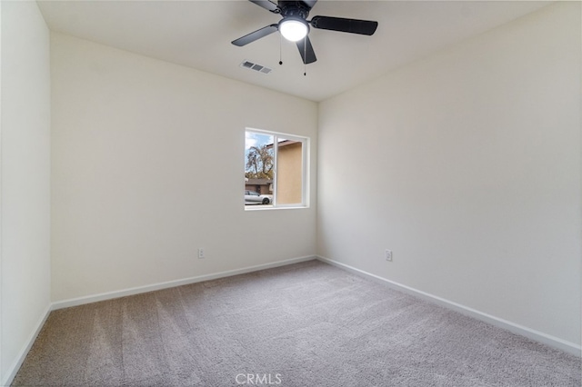 unfurnished room with light carpet and ceiling fan