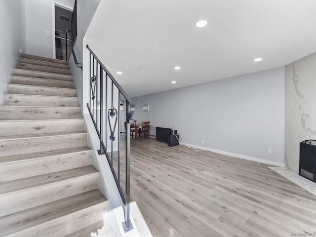 stairway with wood-type flooring