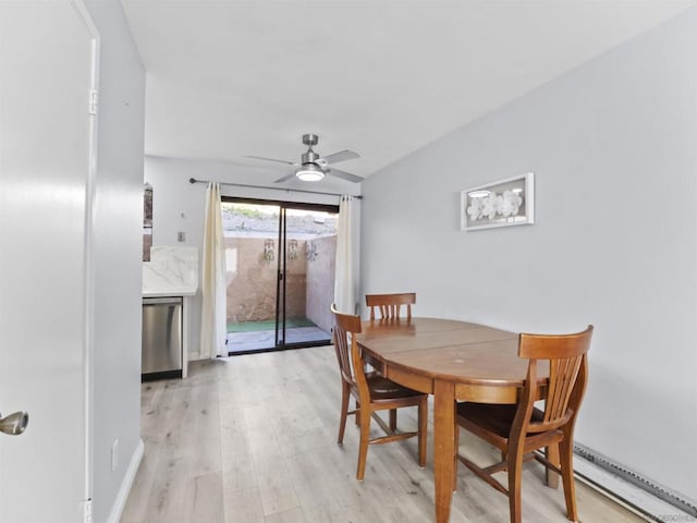 dining space featuring ceiling fan and light hardwood / wood-style floors