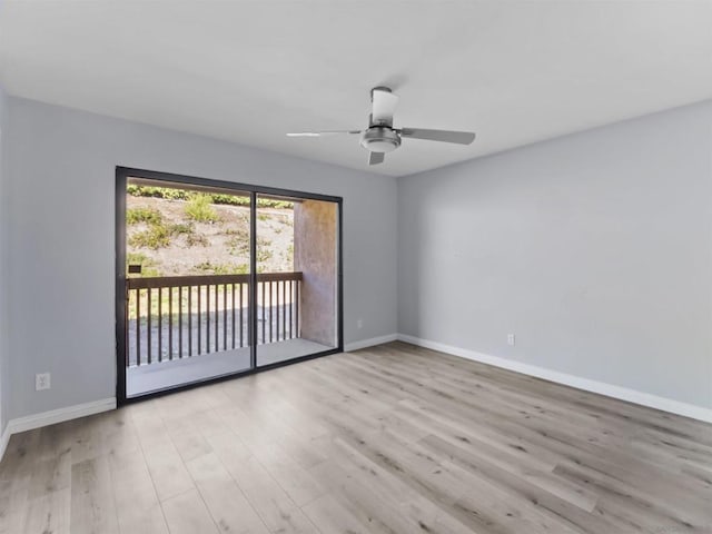 empty room with light hardwood / wood-style flooring and ceiling fan