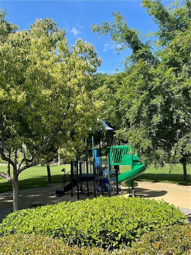 view of playground featuring a lawn