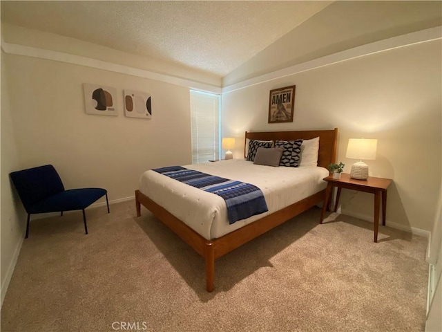 carpeted bedroom featuring vaulted ceiling