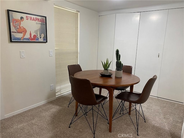 view of carpeted dining area