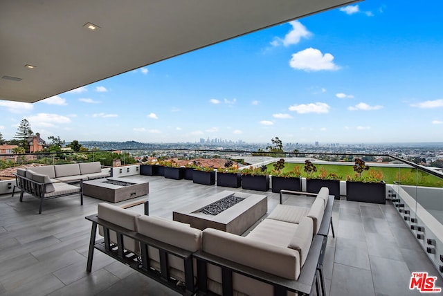 view of patio / terrace featuring an outdoor living space with a fire pit