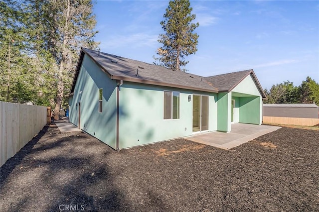 back of property featuring a patio area