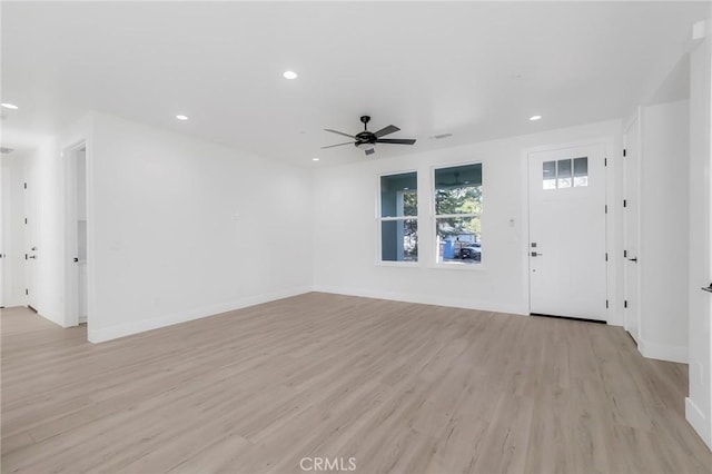 interior space featuring light wood-type flooring and ceiling fan