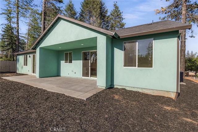 back of property with a patio area