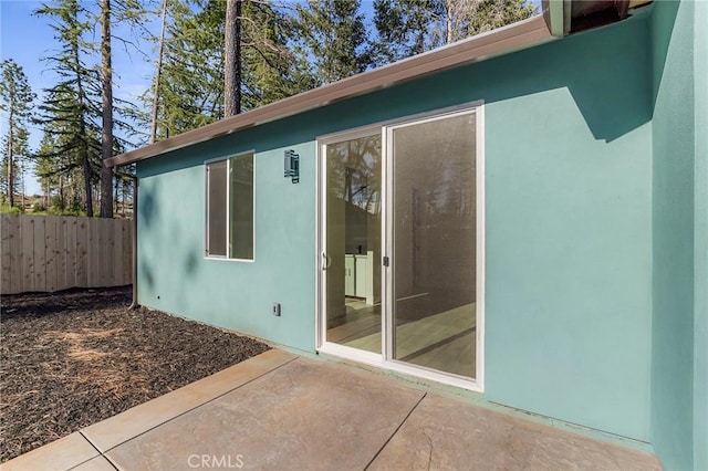 doorway to property featuring a patio area