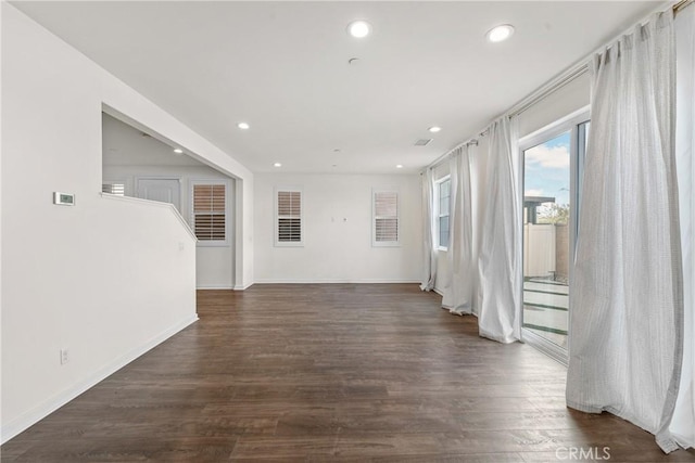 spare room with dark hardwood / wood-style flooring