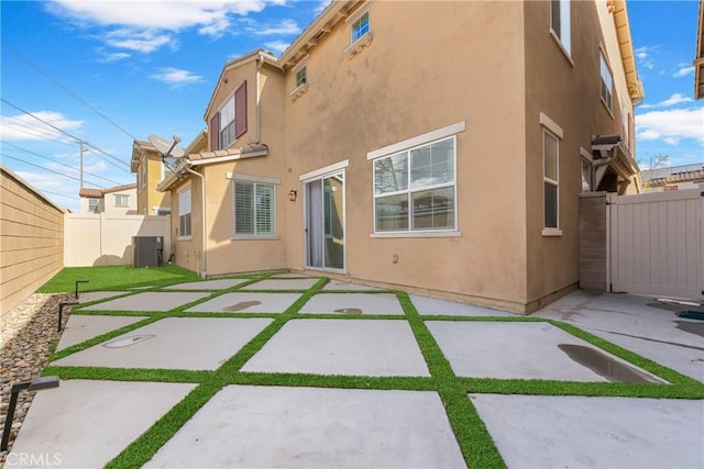 back of house featuring a patio area and central AC