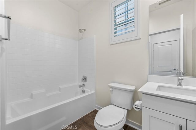 full bathroom featuring vanity, toilet, wood-type flooring, and shower / tub combination