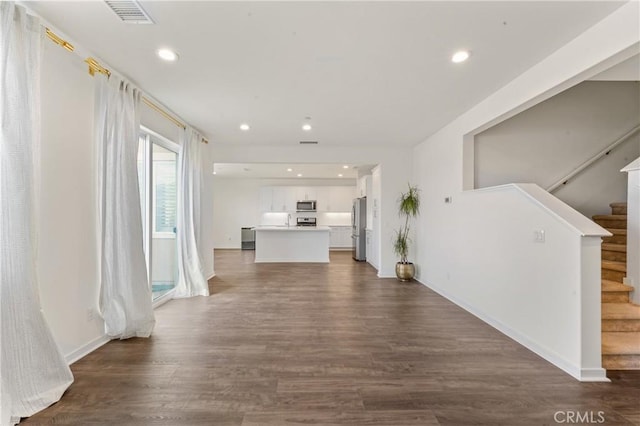 hall with dark hardwood / wood-style floors