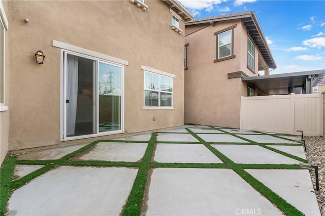 back of house with a patio