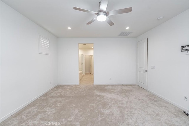 carpeted empty room with ceiling fan