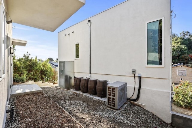 view of side of home featuring ac unit