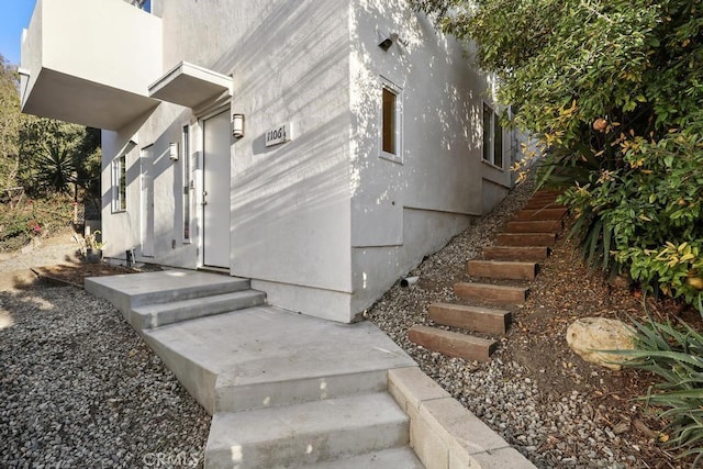 view of side of home featuring stucco siding