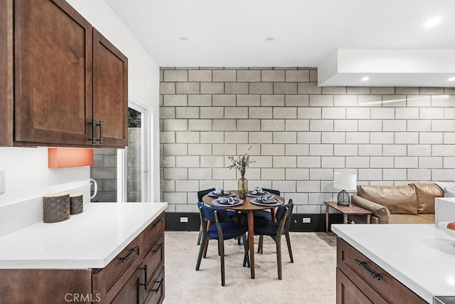 kitchen featuring dark brown cabinets