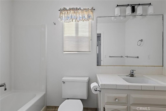 full bathroom with toilet, vanity, and shower / bathtub combination