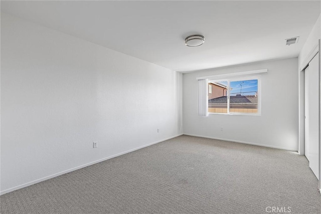 unfurnished room with carpet