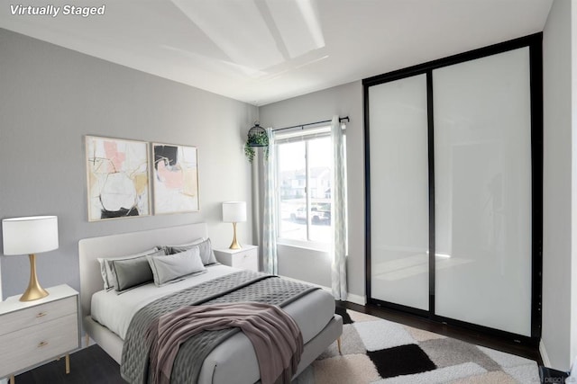 bedroom featuring light hardwood / wood-style flooring and a closet