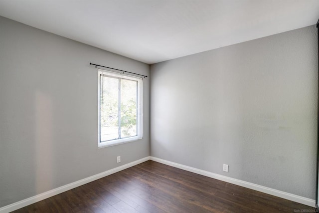 empty room featuring dark hardwood / wood-style floors