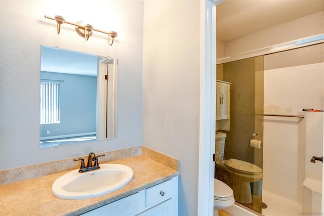 bathroom featuring vanity, toilet, and walk in shower