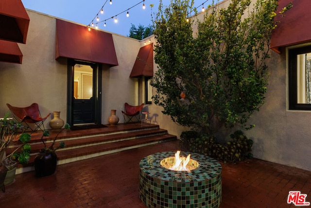 exterior space with an outdoor fire pit