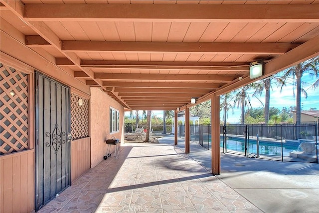 view of patio / terrace with a fenced in pool