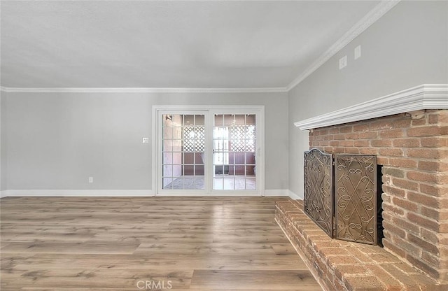 unfurnished living room with crown molding and wood-type flooring