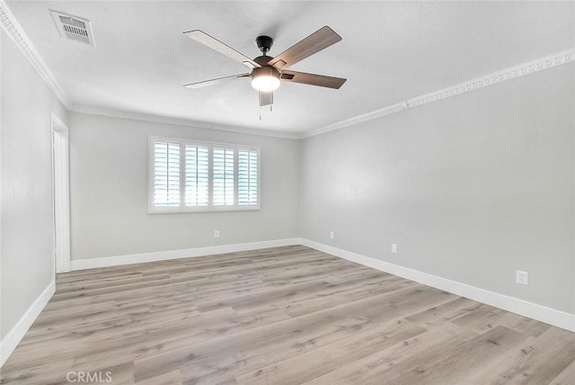 unfurnished room with light hardwood / wood-style floors, ceiling fan, and crown molding