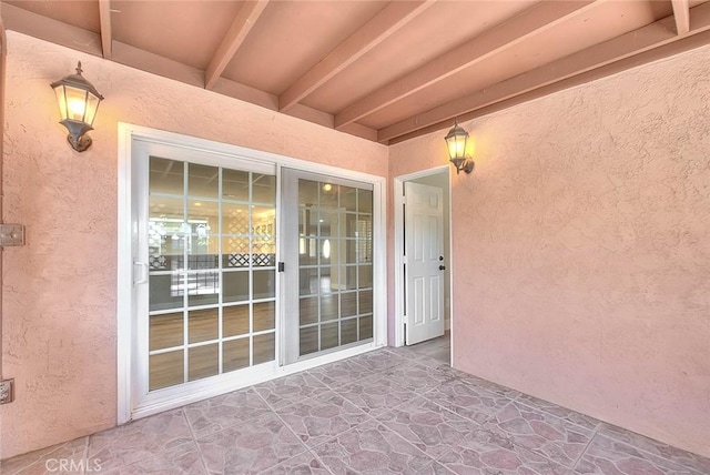 entrance to property featuring a patio area