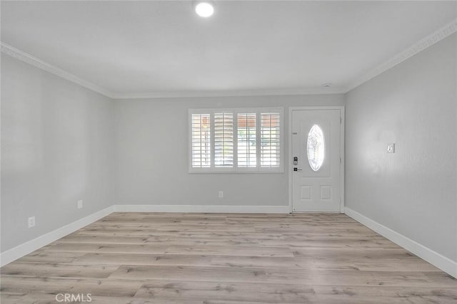 foyer featuring light hardwood / wood-style floors and ornamental molding