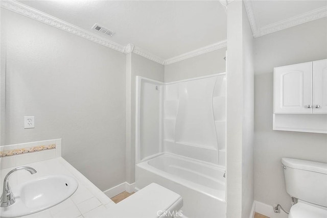 full bathroom featuring shower / tub combination, toilet, vanity, and ornamental molding