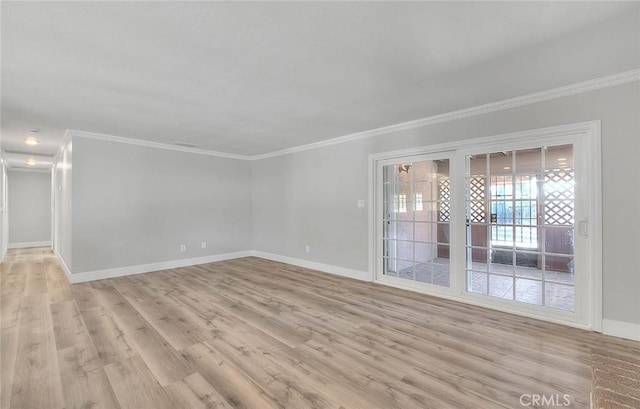 unfurnished room featuring crown molding and light hardwood / wood-style flooring