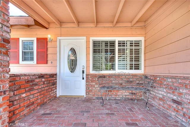 doorway to property featuring a patio area