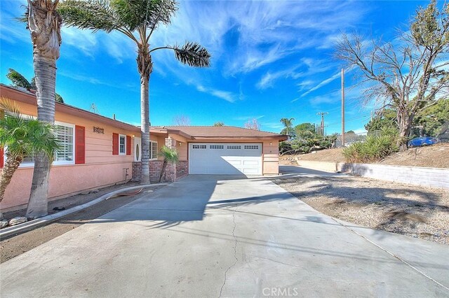 ranch-style home featuring a garage