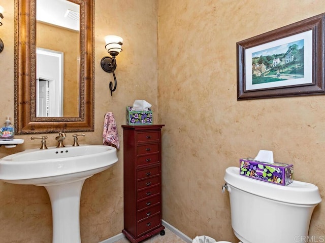 bathroom with sink and toilet