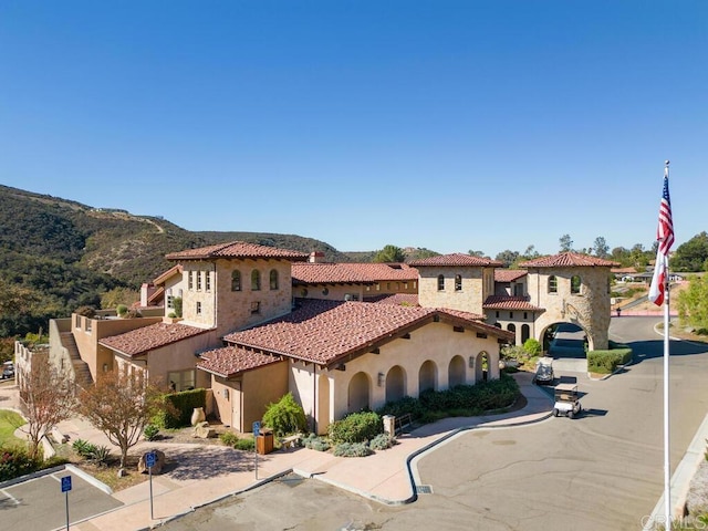 mediterranean / spanish home with a mountain view