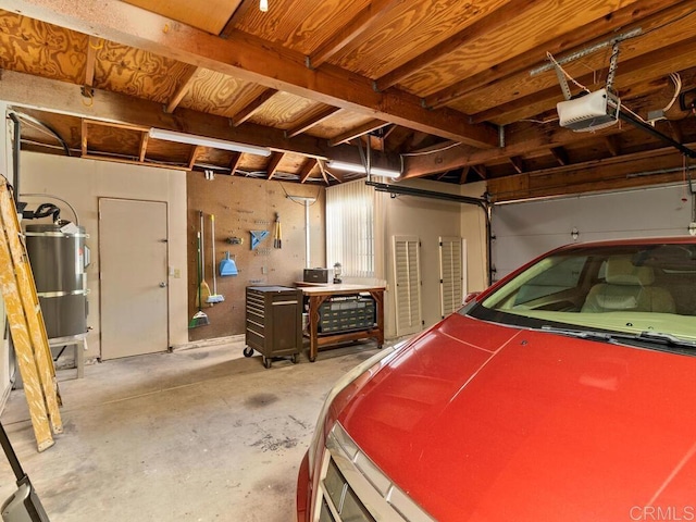 garage with secured water heater and a garage door opener