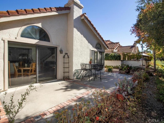 rear view of property featuring a patio