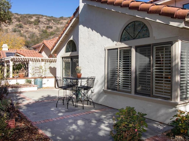 view of patio / terrace with a mountain view