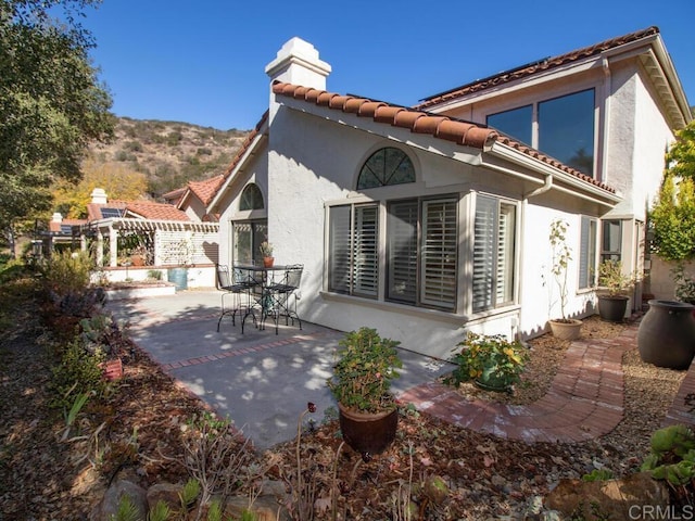 back of house featuring a patio