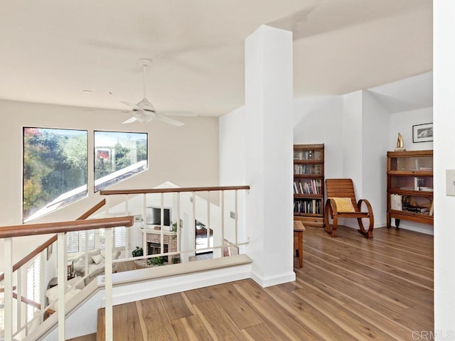 living room with ceiling fan and hardwood / wood-style floors