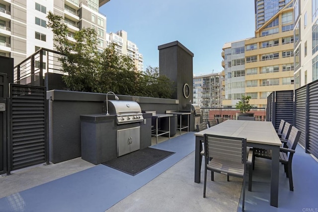 view of patio with exterior kitchen and grilling area