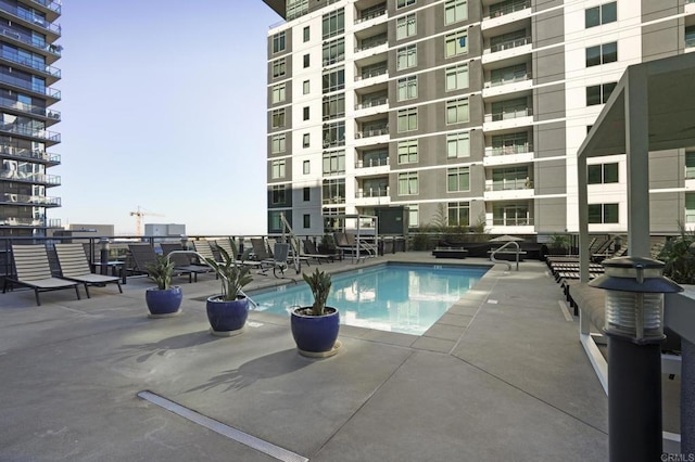 view of swimming pool with a patio