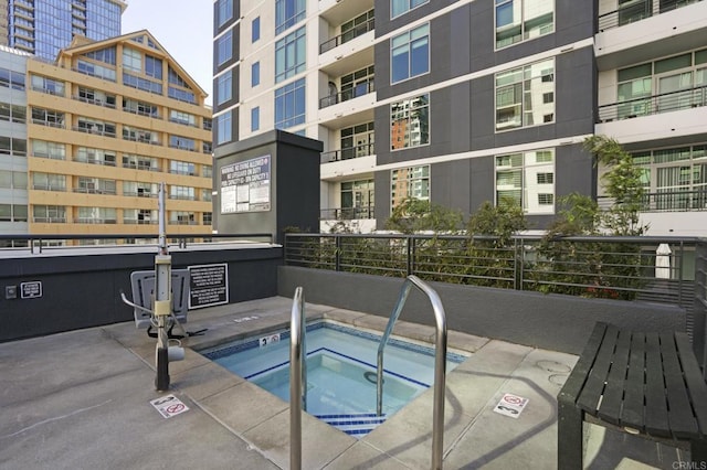 view of pool with a community hot tub